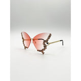 SVNX butterfly sunglasses with gradient pink lenses and gold frame (British brand)