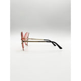 SVNX butterfly sunglasses with gradient pink lenses and gold frame (British brand)