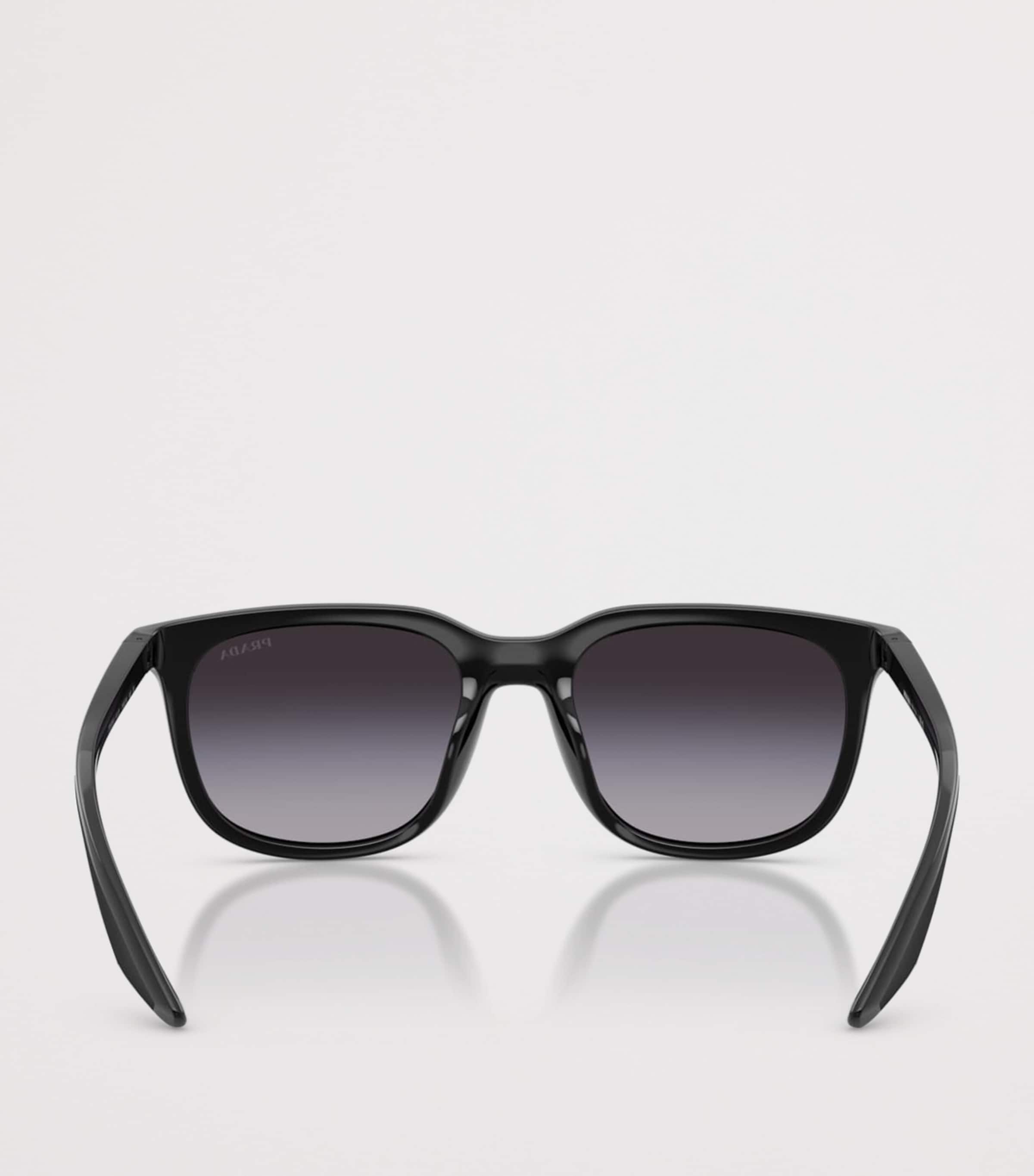 Prada Linea Rossa pillow sunglasses with tinted lenses, imported from the UK