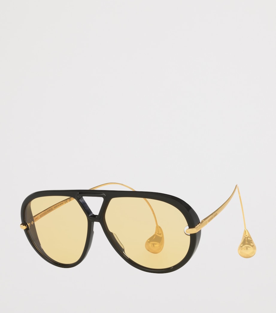 Bottega Veneta aviator sunglasses with drop-shaped temple tips, imported from the UK