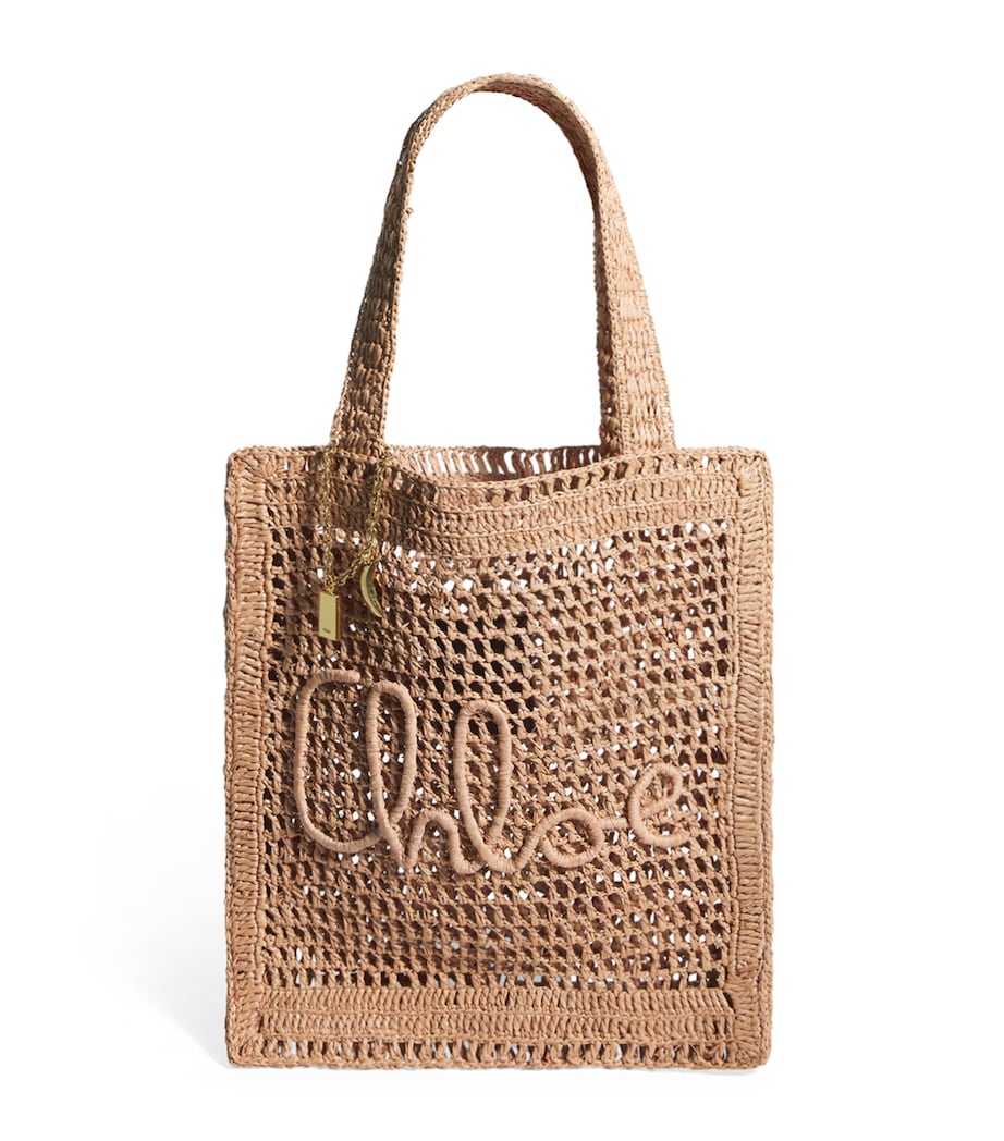 Chloé handwoven banana tote bag with gold charm, imported from the UK