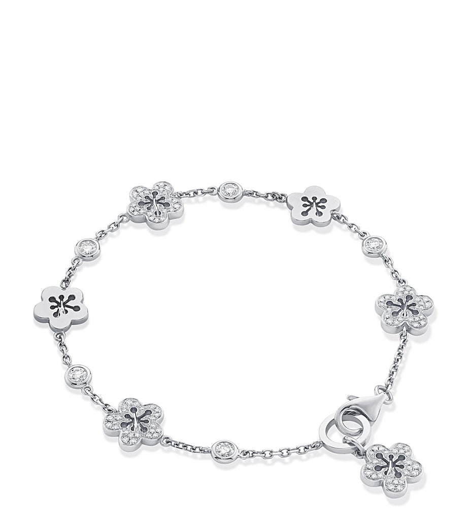Boodles 18kt white gold diamond blossom charm bracelet, imported from the UK