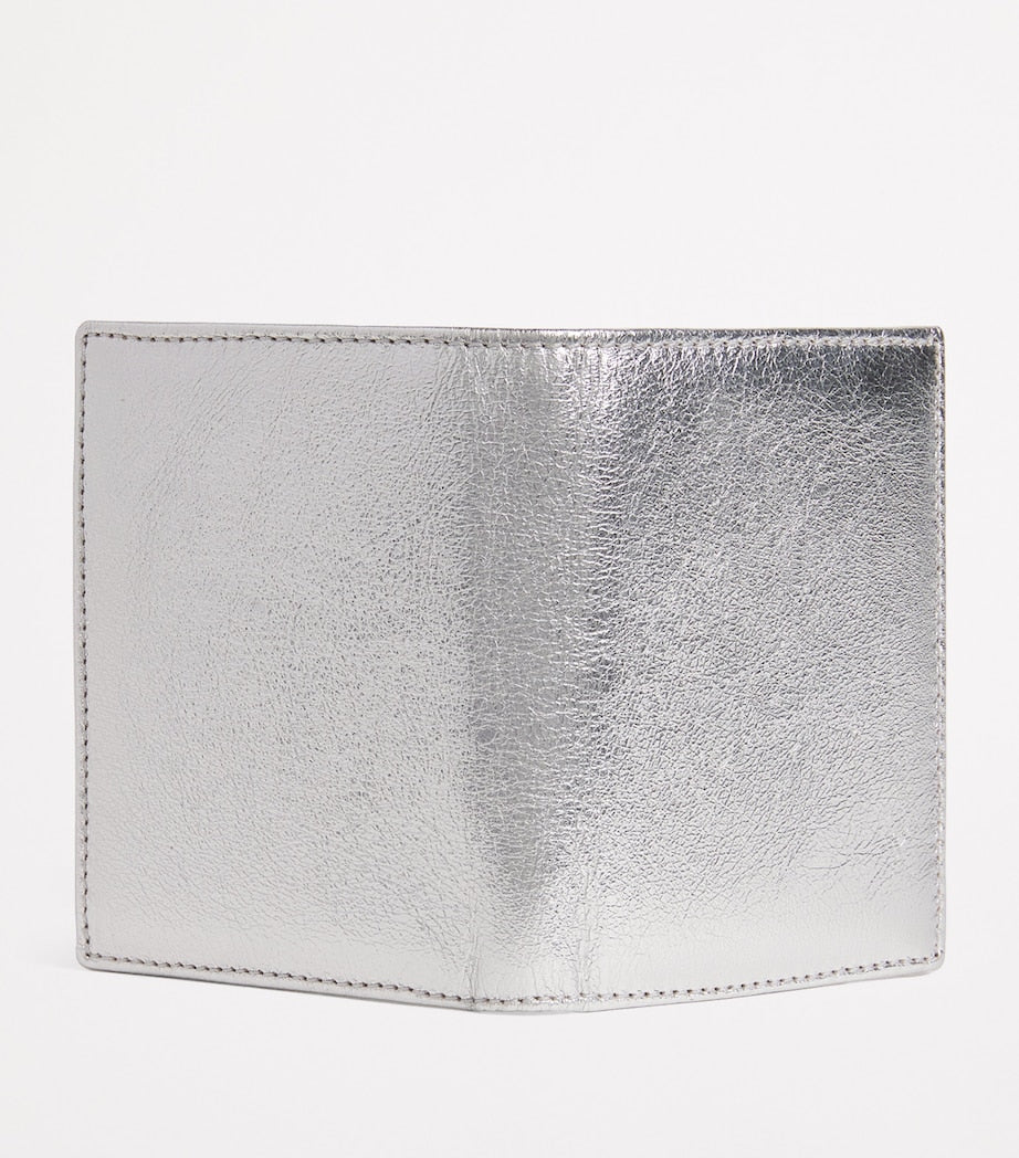 Comme Des Garçons leather folding card holder with silver metallic strip, UK version
