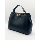 SVNX black faux leather handbag with gold trim (British brand)