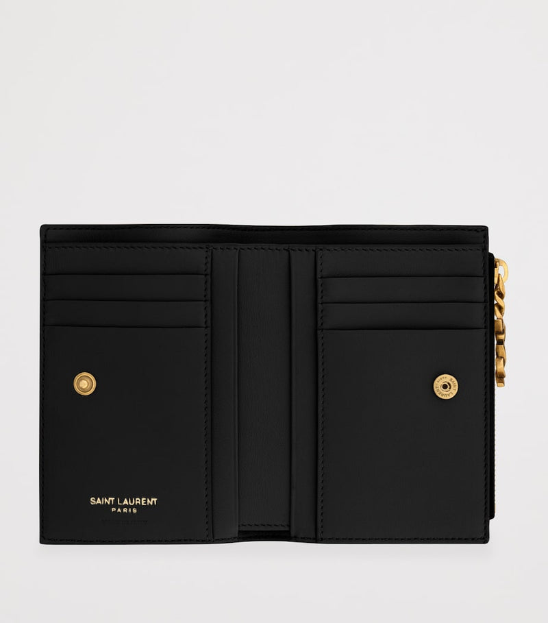 Saint Laurent quilted bifold wallet with YSL monogram (British brand)