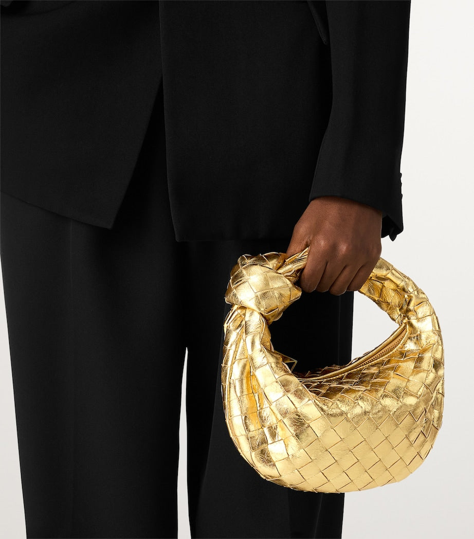 Bottega Veneta mini metallic leather top-handle bag, imported from the UK