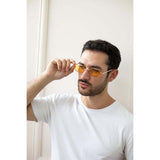 SVNX oval sunglasses with orange lenses and gold frame, imported from the UK