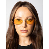 SVNX oval sunglasses with orange lenses and gold frame, imported from the UK