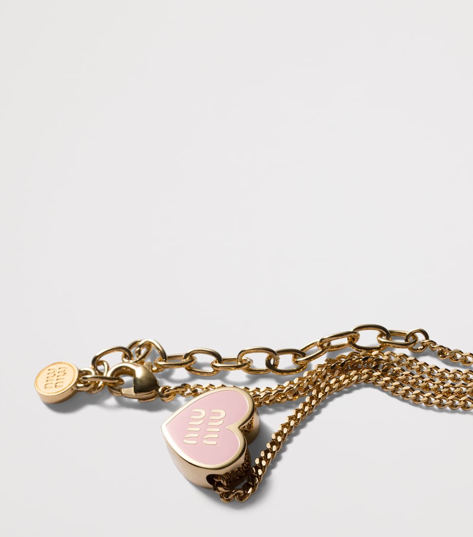 Miu Miu heart pendant necklace with enamel trim, imported from the UK