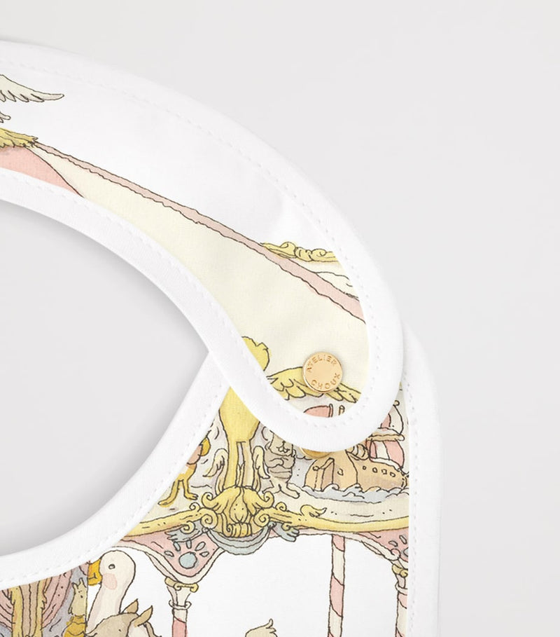 Atelier Choux organic cotton carousel print bib, UK version
