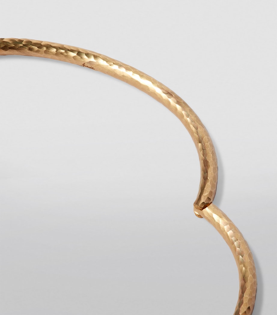 Annoushka yellow gold bangle with hand-hammered finish, imported from the UK
