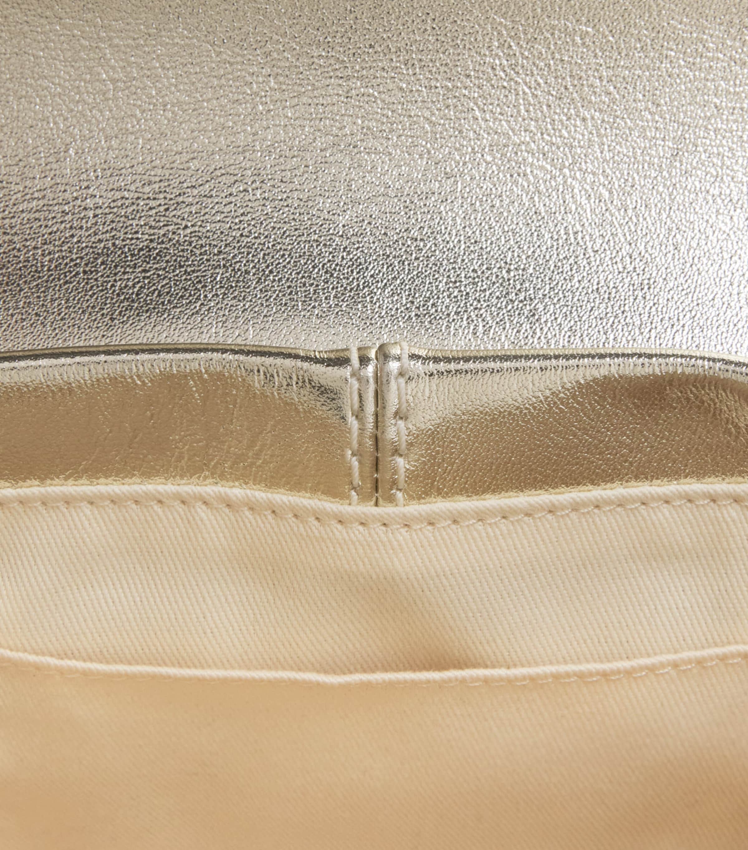 Maje metallic leather Miss M clutch bag with gold buckle, imported from the UK