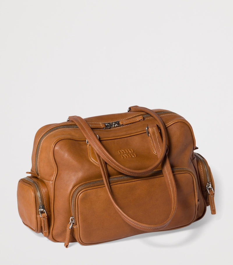 Miu Miu nappa leather top-handle bag with utility pockets (British brand)