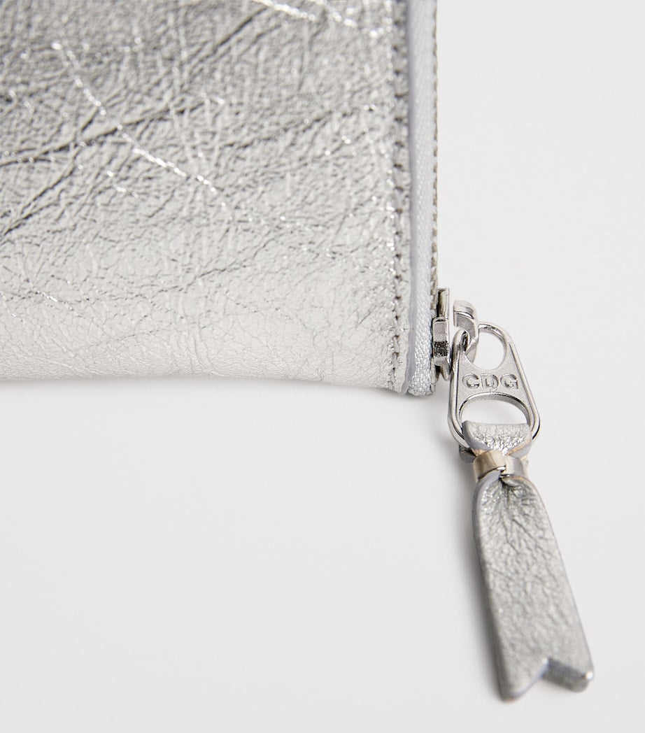 Comme des Garçons small leather half-zip wallet, UK version