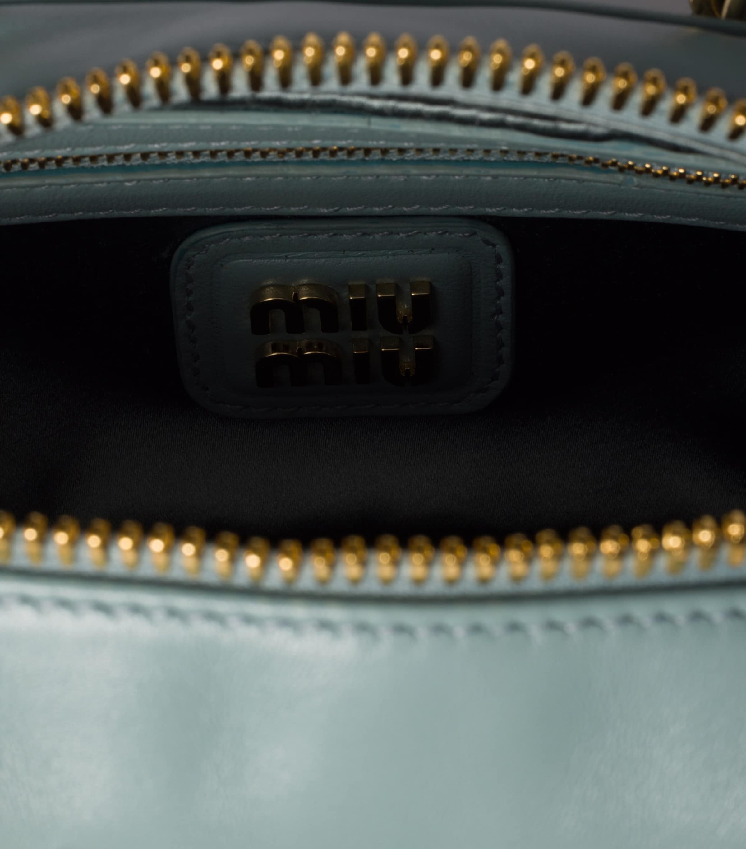 Miu Miu Arcadie top-handle bag matelassé leather, imported from the UK