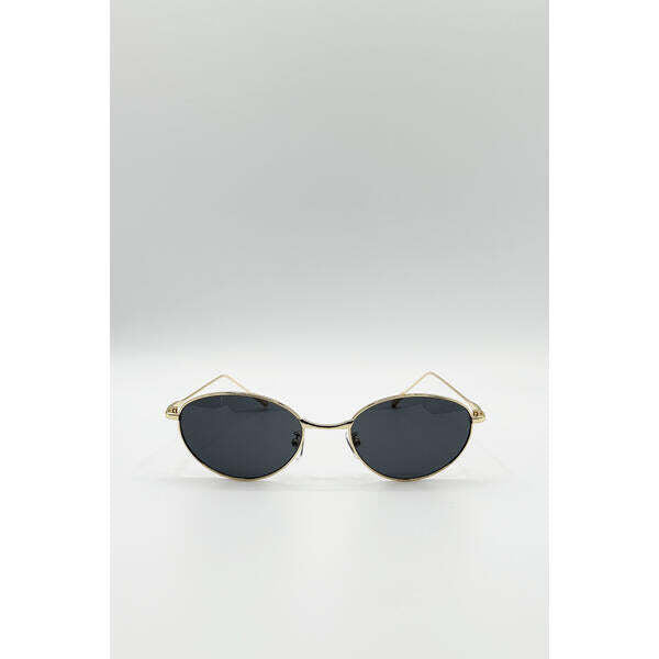 SVNX cat eye sunglasses in black with gold frame, UK version