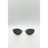 SVNX cat eye sunglasses in black with gold frame, UK version