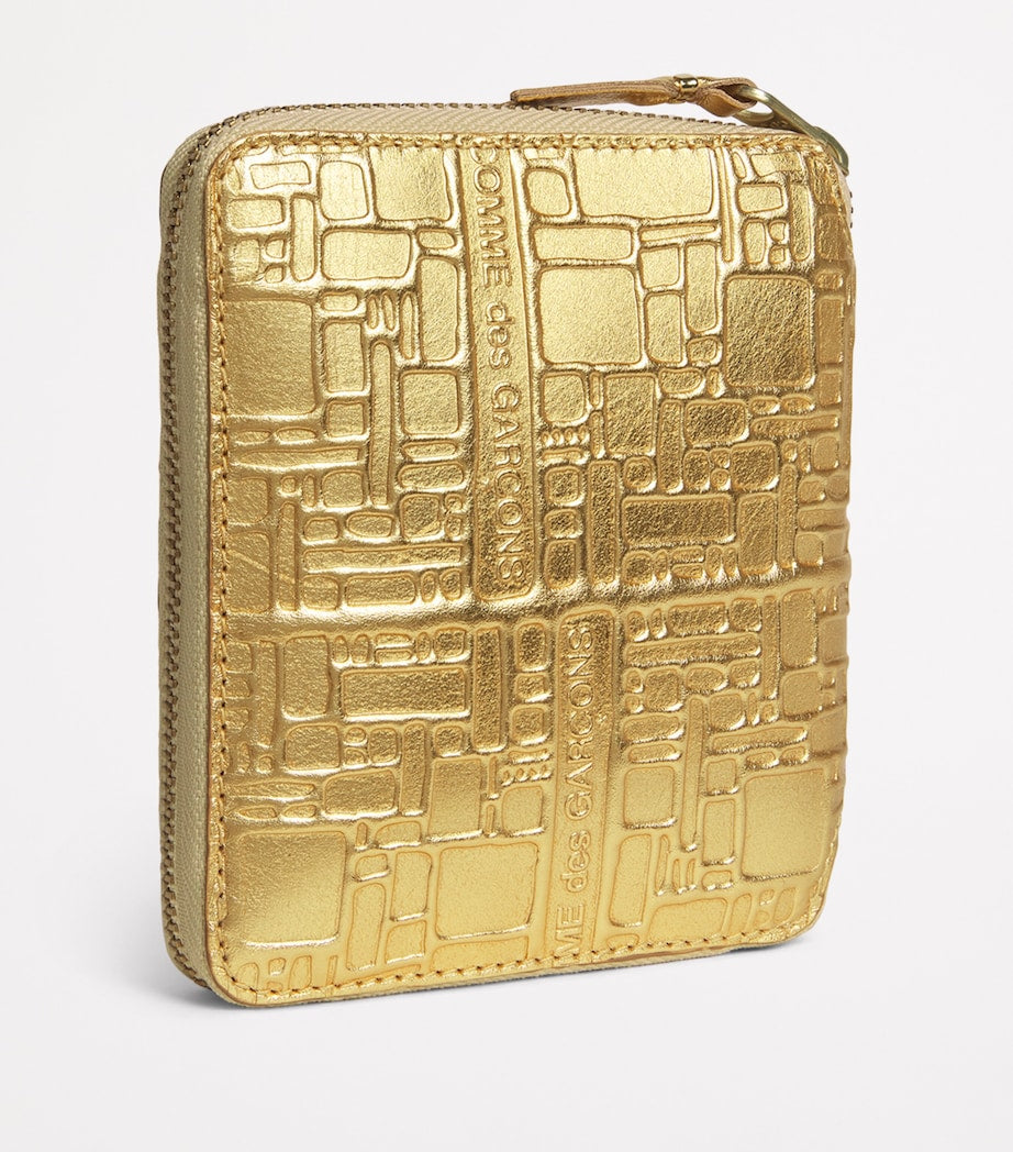 Comme Des Garçons gold embossed leather wallet, imported from the UK