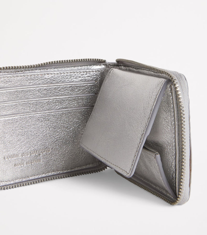 Comme des Garçons wallet embossed logo zip, imported from the UK