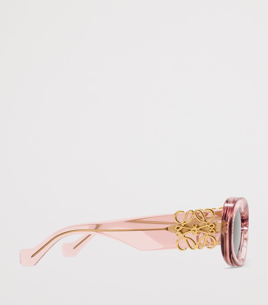 LOEWE oval sunglasses with bevelled acetate frame, imported from the UK