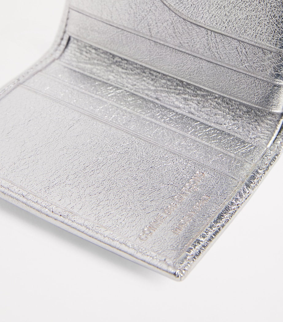 Comme Des Garçons leather folding card holder with silver metallic strip, UK version