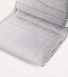 Comme Des Garçons leather folding card holder with silver metallic strip, UK version