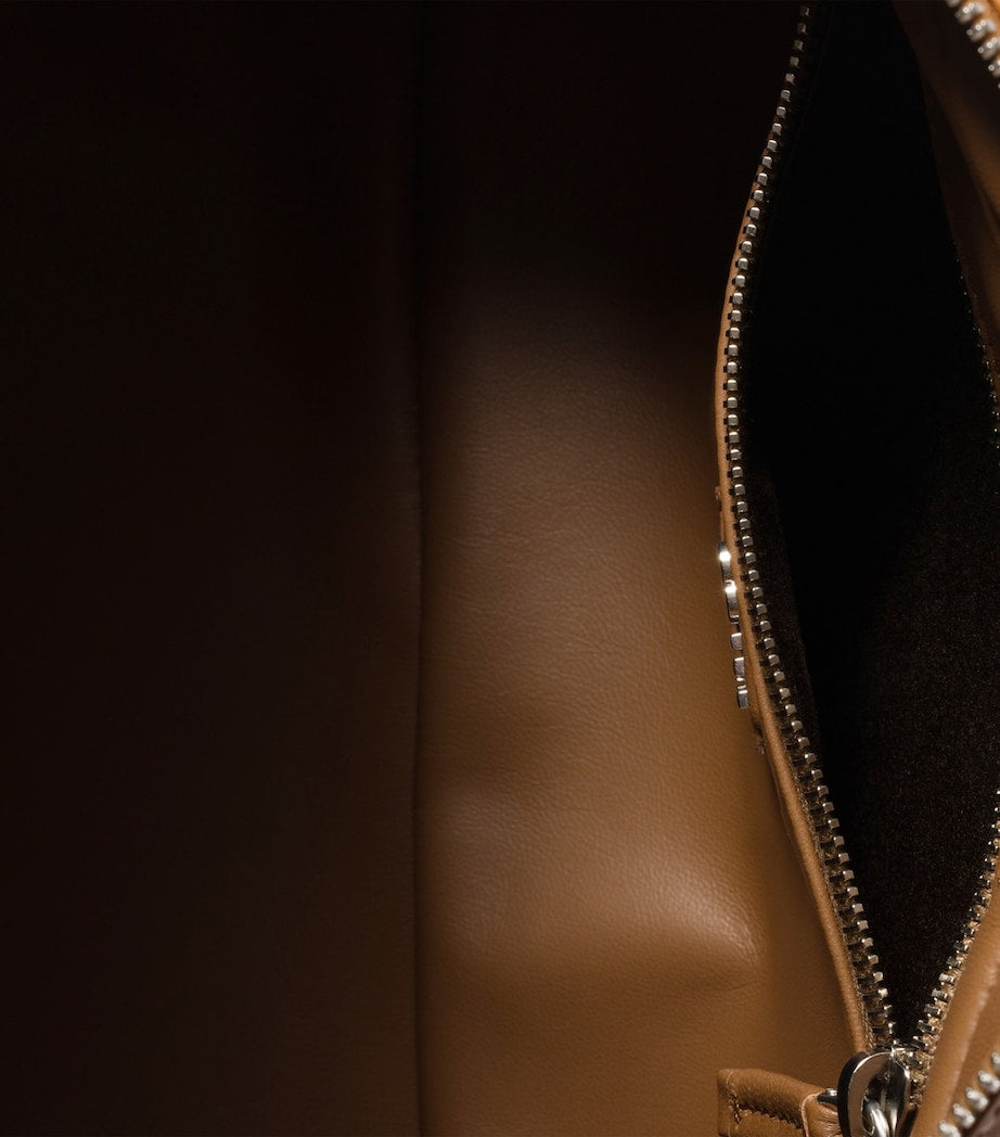 Miu Miu nappa leather top-handle bag with utility pockets (British brand)
