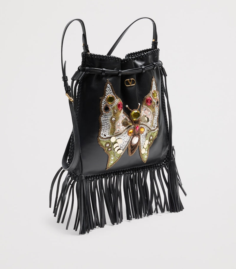Valentino Garavani Nellcôte lambskin bucket bag with butterfly motif, imported from the UK