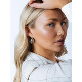 SVNX twisted ribbed hoop earrings in silver (British brand)