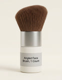 Hermès travel-sized face brush with angled bristles, imported from the UK
