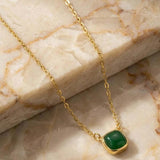 MUCHV gold square necklace with emerald green stone, imported from the UK