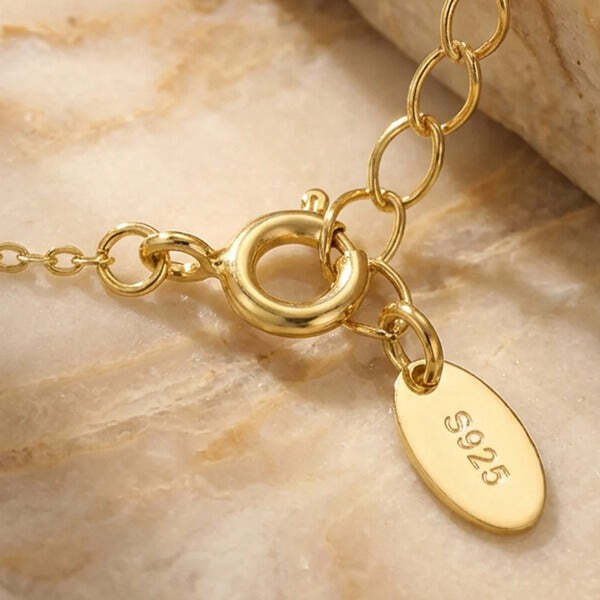 MUCHV gold square necklace with emerald green stone, imported from the UK