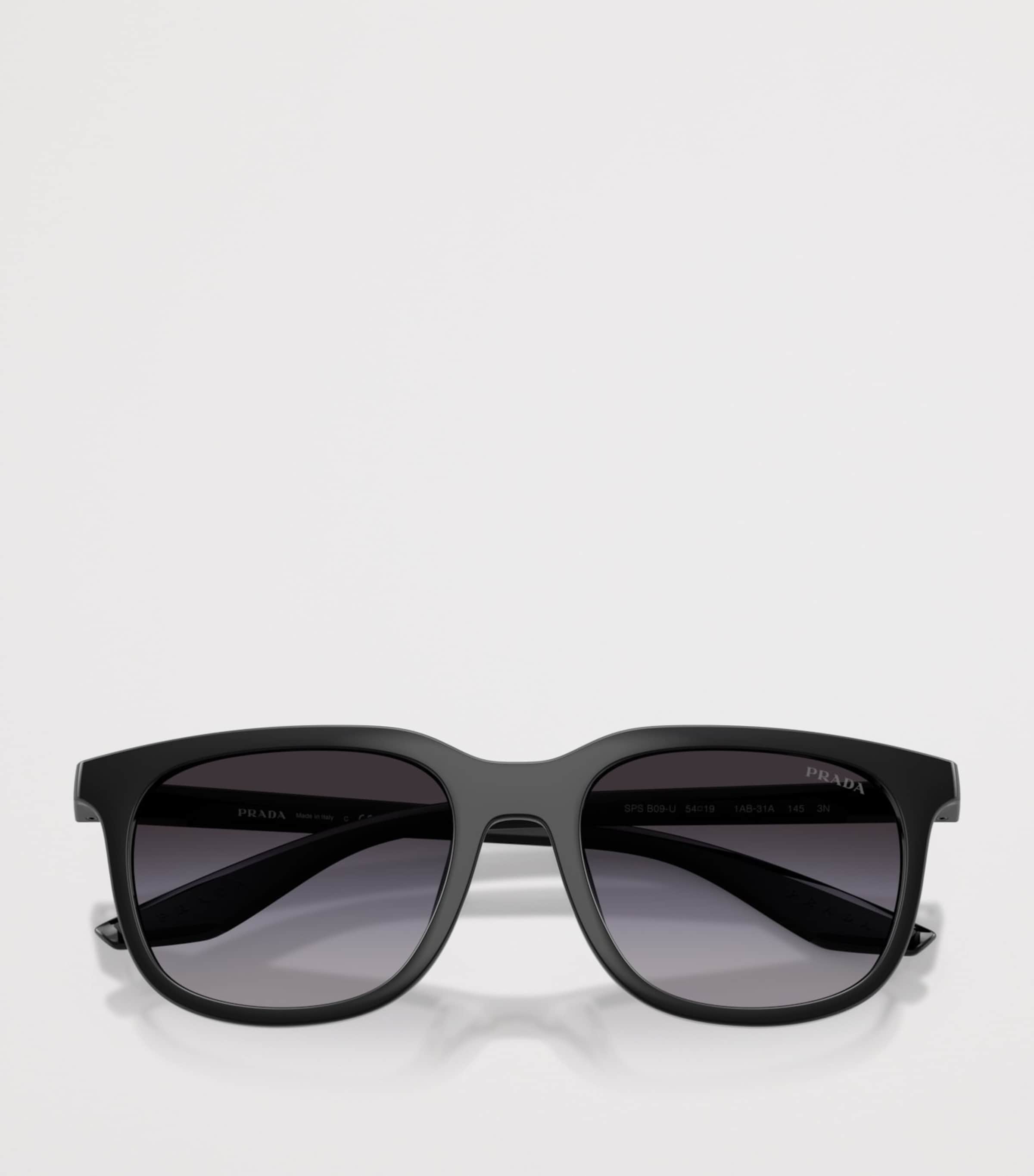 Prada Linea Rossa pillow sunglasses with tinted lenses, imported from the UK