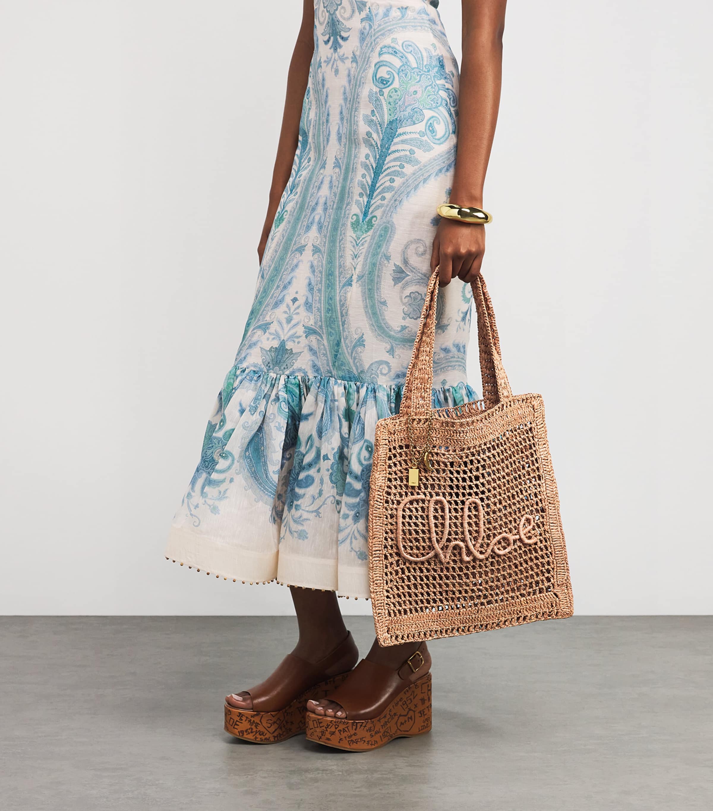 Chloé handwoven banana tote bag with gold charm, imported from the UK