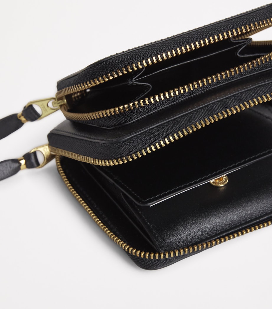 Comme des Garçons zipped leather wallet - British product