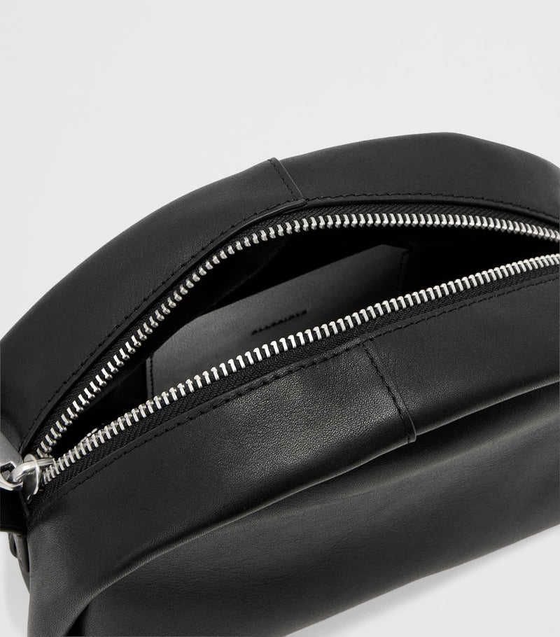 AllSaints Rosalie Arc cross-body bag in calfskin leather, imported from the UK