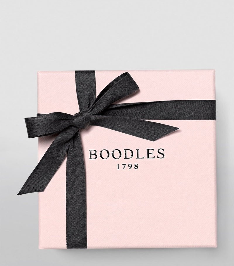 Boodles platinum diamond petal wedding ring, imported from the UK