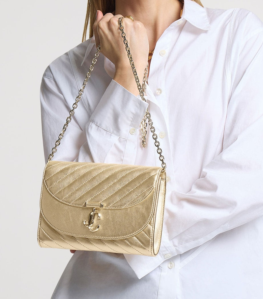 Jimmy Choo Curve clutch bag in metallic leather, imported from the UK