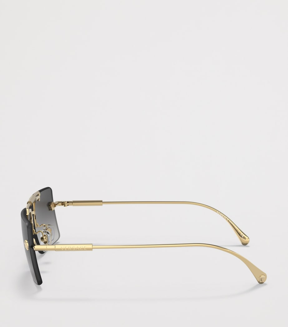 Lunettes de soleil rectangulaires sans monture Versace en métal doré - Produit britannique
