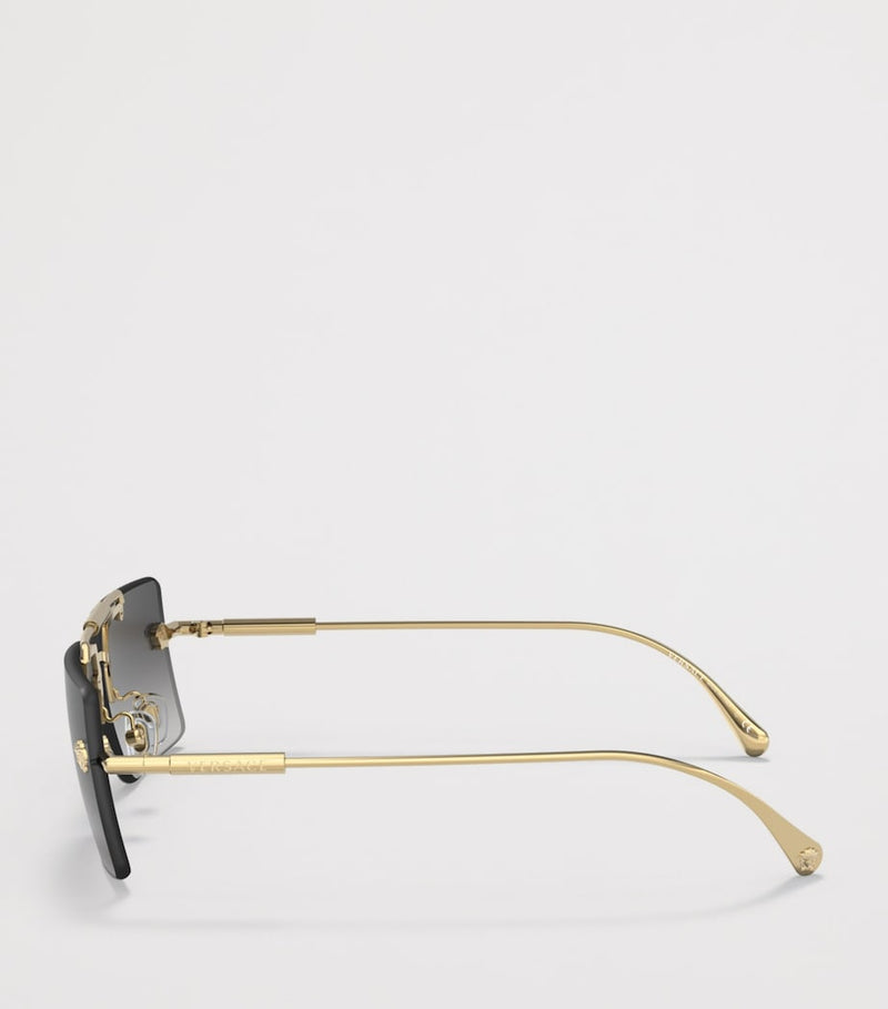 Lunettes de soleil rectangulaires sans monture Versace en métal doré - Produit britannique