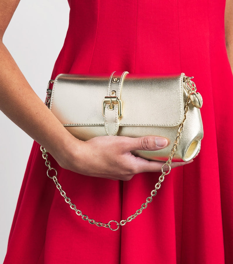 Maje metallic leather Miss M clutch bag with gold buckle, imported from the UK