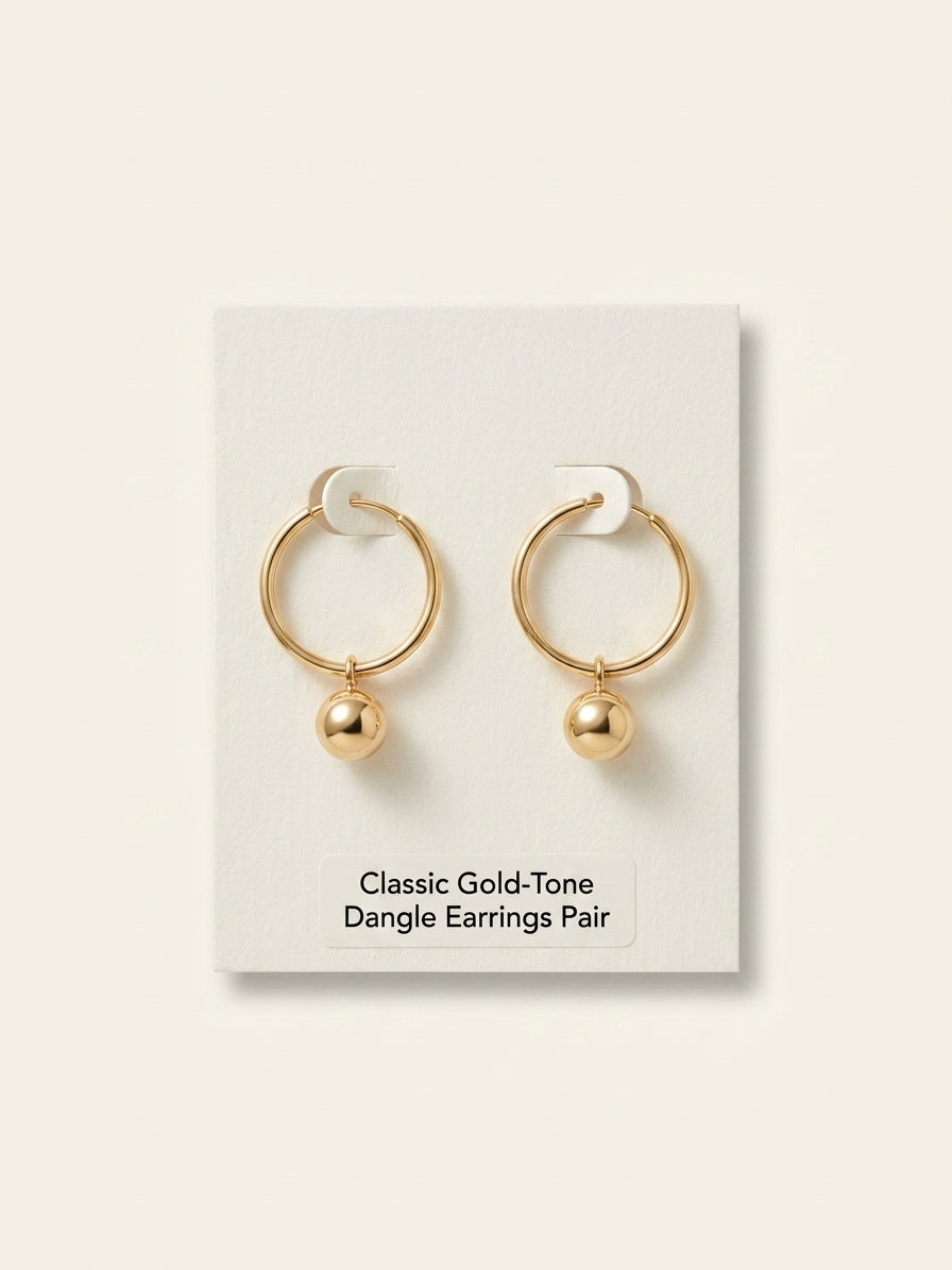 Vivienne Westwood brass heart earrings with orb charm, imported from the UK