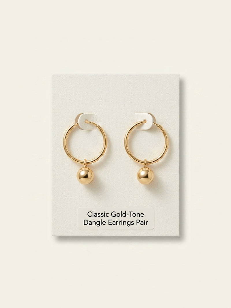 Vivienne Westwood brass heart earrings with orb charm, imported from the UK