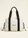 Burberry quilted nylon changing bag with cross-body strap, imported from the UK