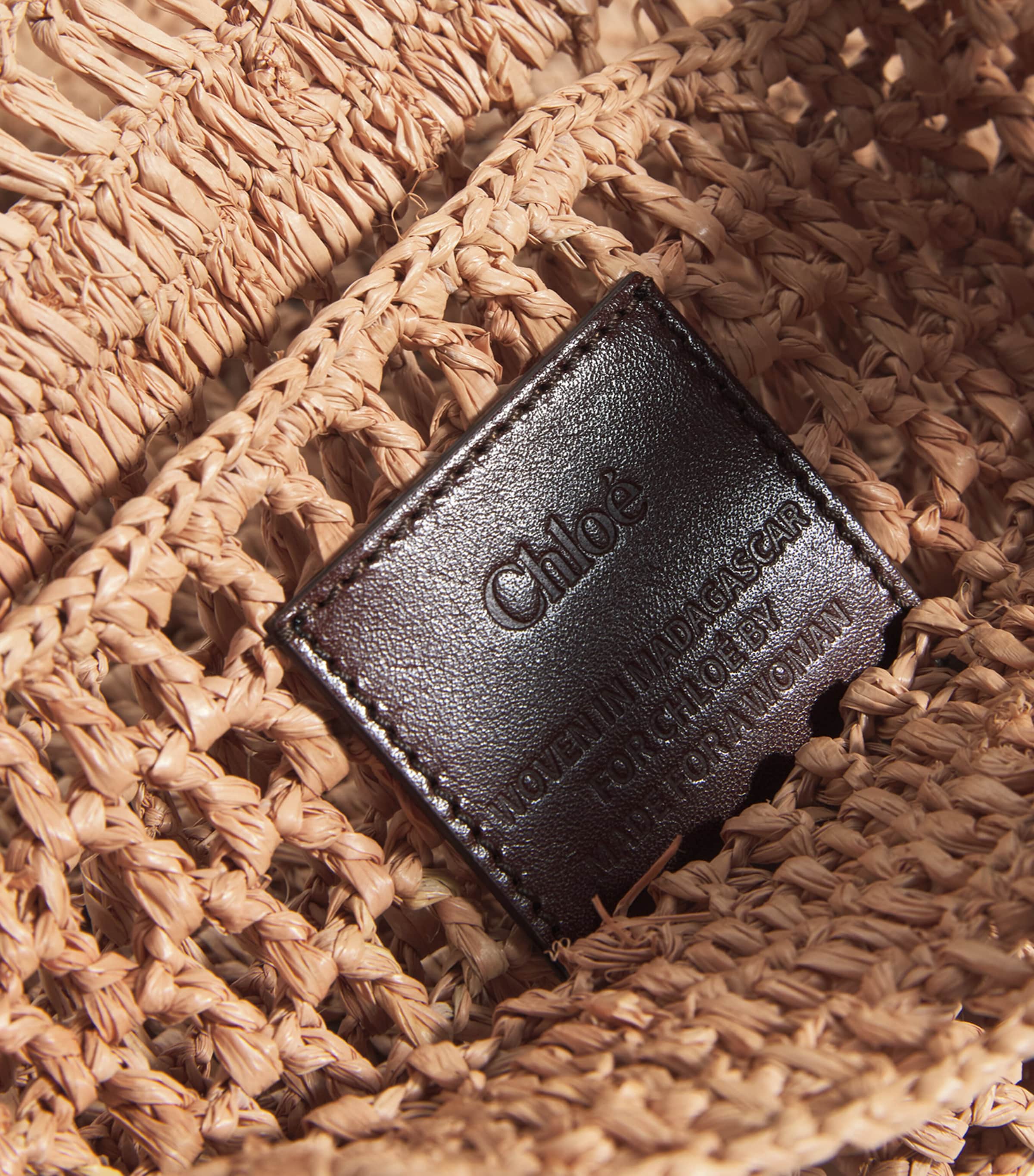Chloé handwoven banana tote bag with gold charm, imported from the UK
