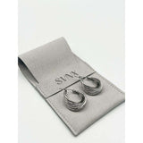 SVNX twisted ribbed hoop earrings in silver (British brand)