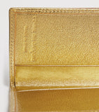 Comme des Garçons vertical card holder with gold metallic accent, imported from the UK