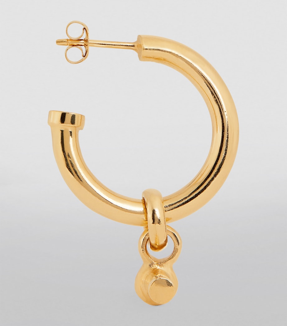Tilly Sveaas large gold-plated T-bar hoop earrings, UK version