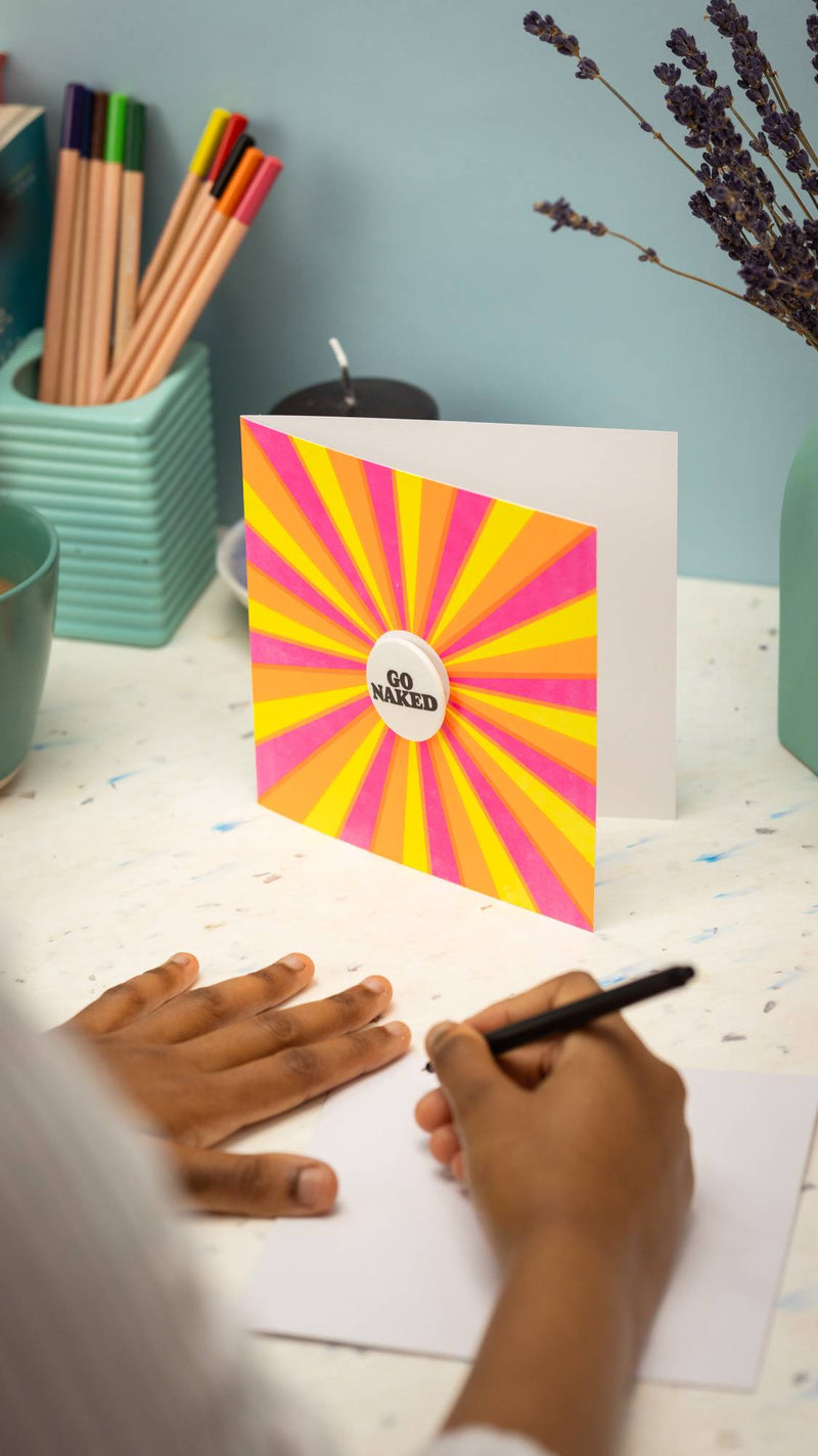 Lush Go Naked greetings card with pin badge, UK version