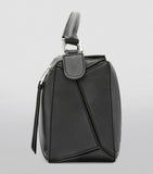 Small Leather Puzzle Top-Handle Bag GOODS Harrods   